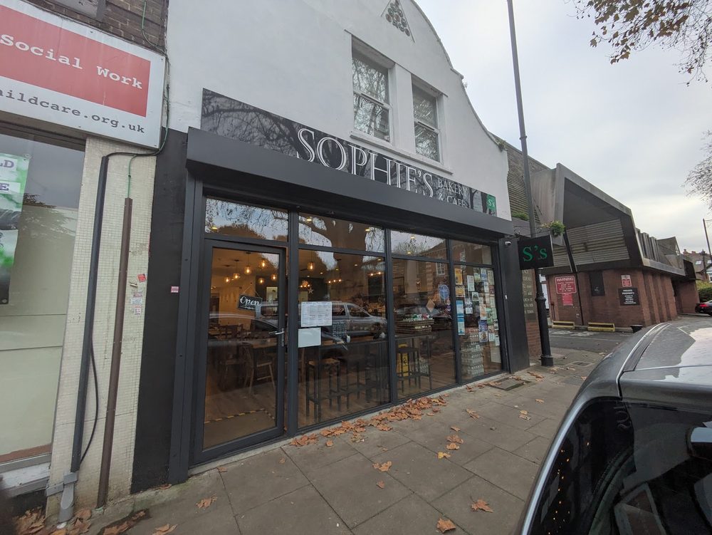 The shopfront of Sophie's Bakery & Café seen from the pavement on Sarnesfield Road